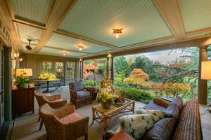 Sunroom / solarium featuring ornate columns and coffered ceiling