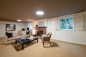 Living room featuring a fireplace and carpet