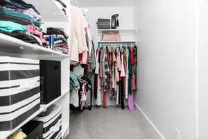 Spacious closet featuring carpet flooring