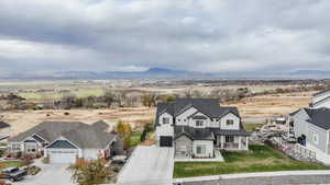 Birds eye view of property with a mountain view