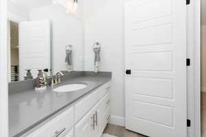 Bathroom with vanity and hardwood / wood-style flooring