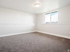 Unfurnished room featuring carpet flooring