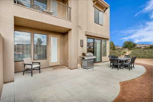 View of patio / terrace featuring a grill and a balcony