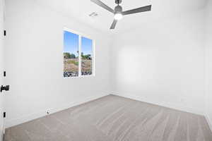 Unfurnished room with ceiling fan and carpet