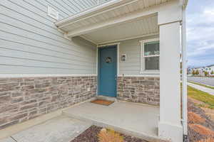 Property entrance with covered porch