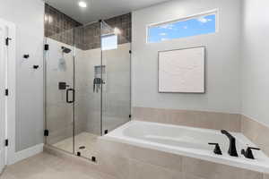 Full bathroom featuring a bath, a shower stall, tile patterned flooring, and recessed lighting