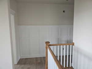 Staircase with hardwood / wood-style floors