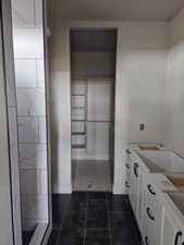 Bathroom with tile patterned flooring and vanity