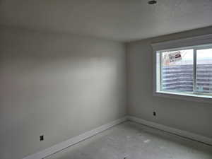 Spare room with a textured ceiling