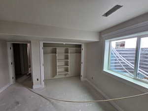 Unfurnished bedroom featuring a textured ceiling