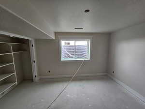 Unfurnished bedroom with a textured ceiling