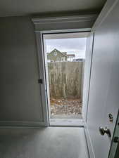 Doorway featuring concrete flooring