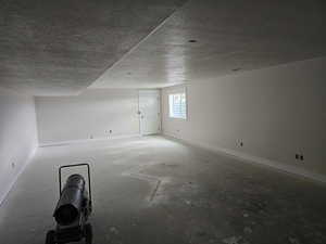 Empty room with a textured ceiling