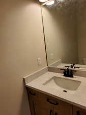 Bathroom with vanity and toilet