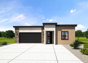 Modern home with a garage and a front yard