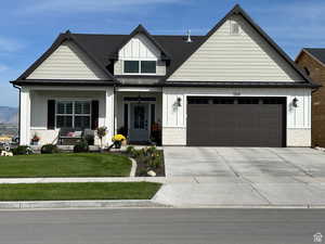 View of front facade with a garage and a front yard