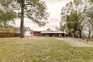 View of yard featuring a playground