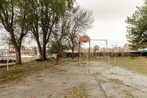 View of playground featuring basketball court