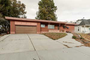 Ranch-style house featuring a garage