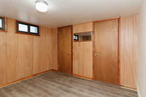 Basement featuring light hardwood / wood-style floors