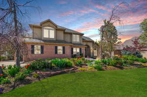 View of front of property with a lawn