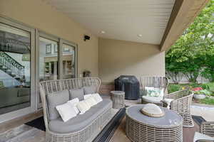 View of patio featuring an outdoor hangout area and grilling area