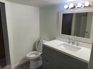 Bathroom with vanity and toilet