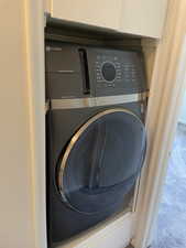 Laundry area featuring carpet flooring and washer / clothes dryer