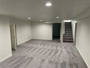 Basement with light carpet