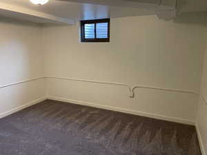 Basement featuring carpet flooring