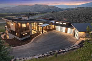 View of front of house with a mountain view and a garage