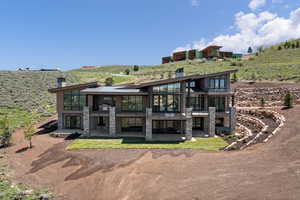 Rear view of house featuring a patio area