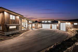 Property exterior at dusk with a garage