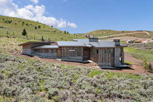 Back of property with a mountain view