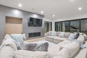 Living room featuring a fireplace and light hardwood / wood-style flooring