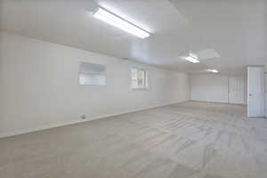 Carpeted empty room with a textured ceiling