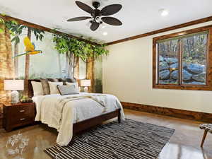 Bedroom with ceiling fan, crown molding, and concrete flooring