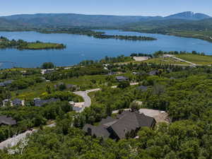 Birds eye view of property featuring a water and mountain view