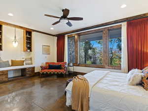 Bedroom featuring ceiling fan, crown molding, and concrete flooring