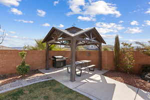 View of patio / terrace featuring a gazebo and a grill