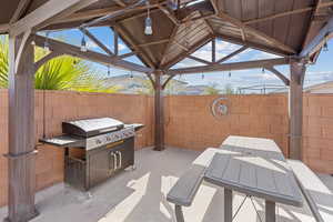 View of patio featuring a gazebo and a mountain view