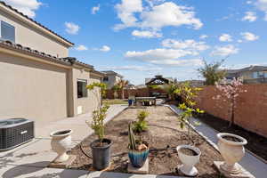 View of yard with a gazebo, central AC, and a patio area