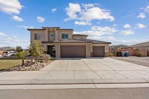 Mediterranean / spanish-style home featuring a garage