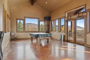 Playroom featuring pool table, beamed ceiling, french doors, and high vaulted ceiling