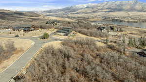 Drone / aerial view with a water and mountain view