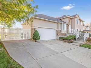 View of front of property featuring a garage