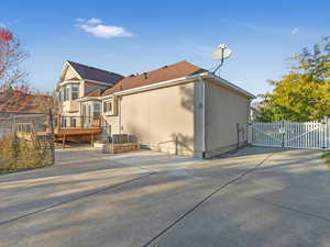 Rear view of house featuring a deck