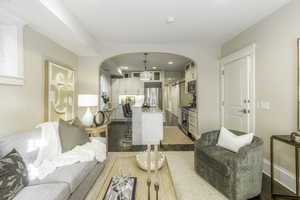 Living room with light hardwood / wood-style flooring