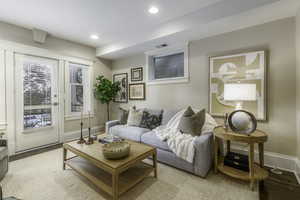 Living room with light hardwood / wood-style flooring