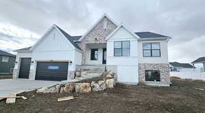 View of front of property featuring a garage